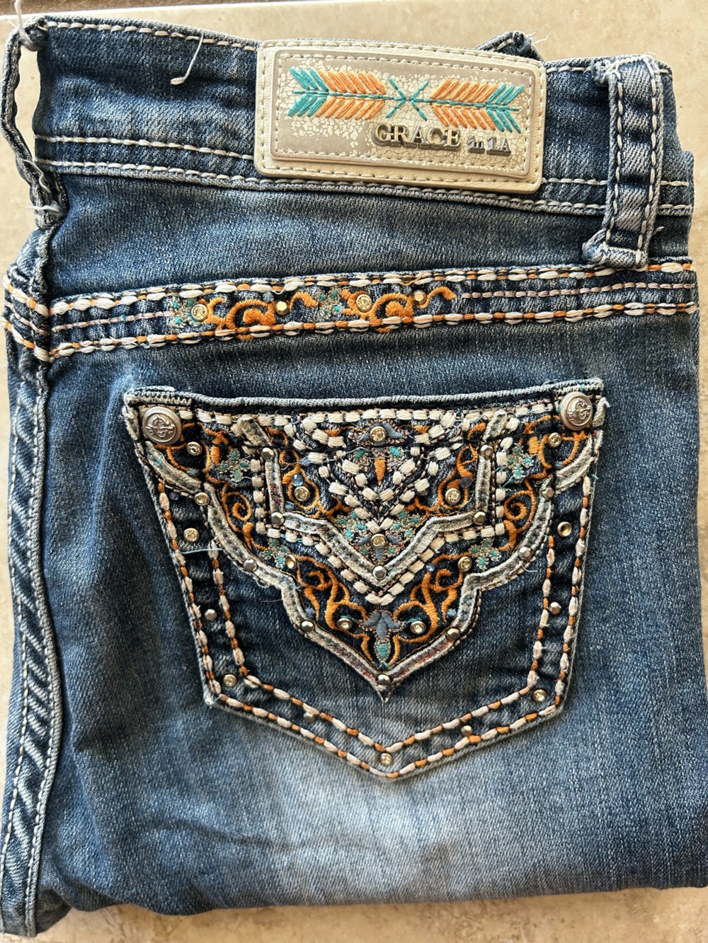 Grace in LA Blue Denim Boot Cut Jeans with Turquoise and Orange Embroidery
